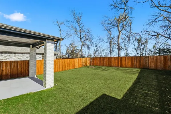 a view of backyard with green space