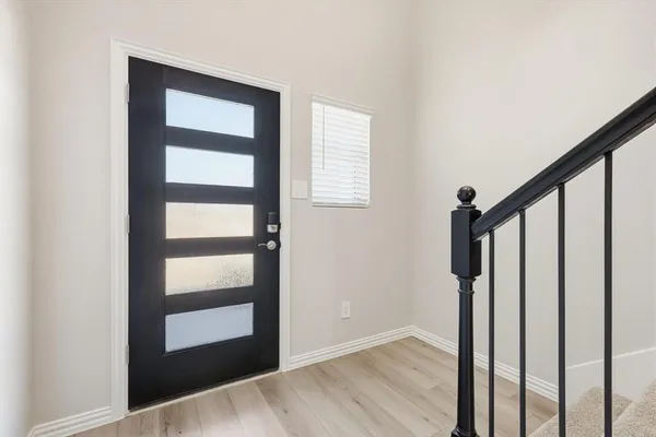 a view of entryway with wooden floor