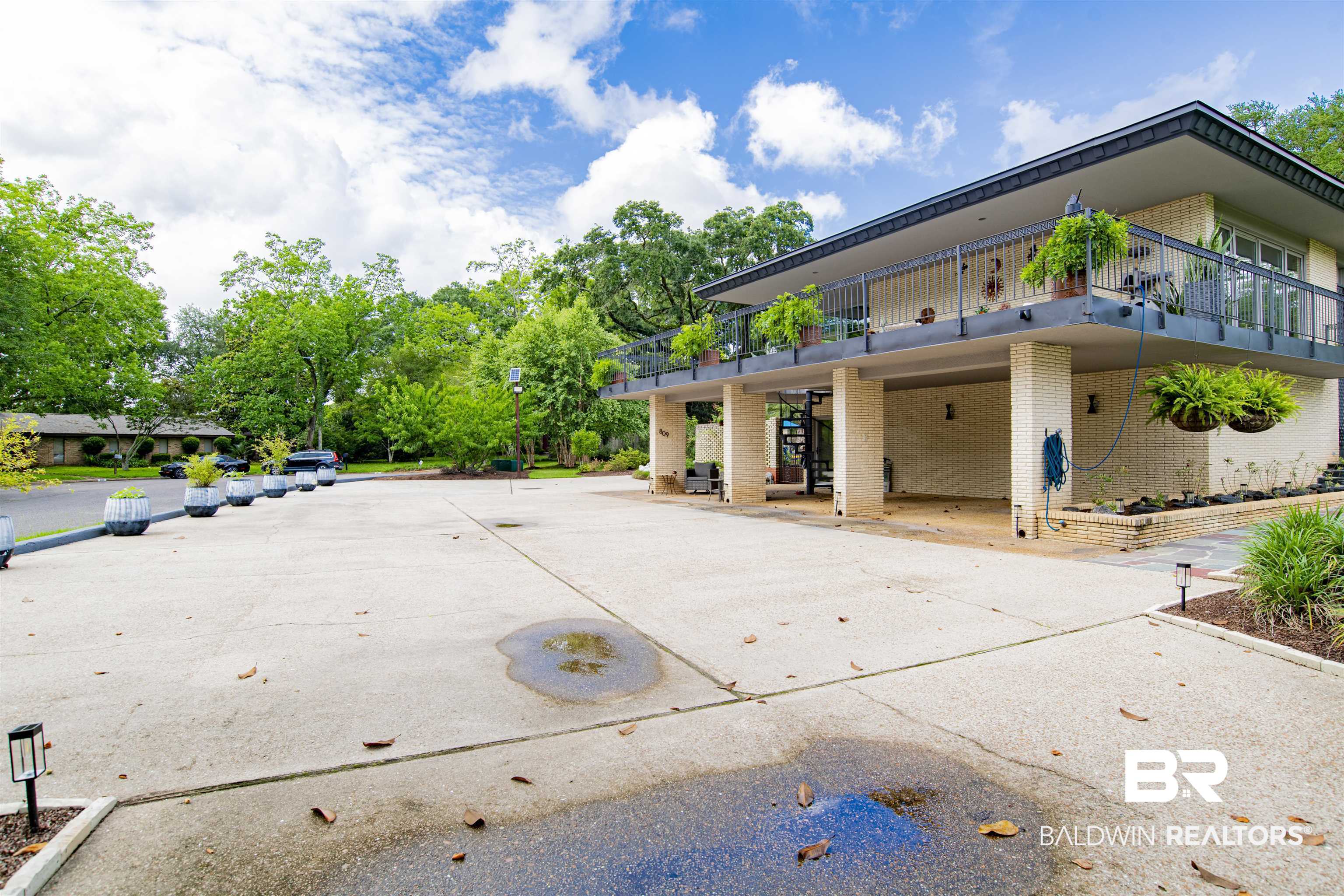 809 Bernard Circle Mobile, AL 36693 - Photo 50 of 75 Contemporary two-story residence with an expansive concrete driveway and carport