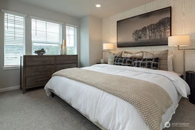 a bedroom with bed and window