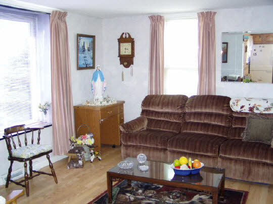 3285 South Chana Road Chana, IL 61015 - Photo 3 of 8 a living room with furniture and a window