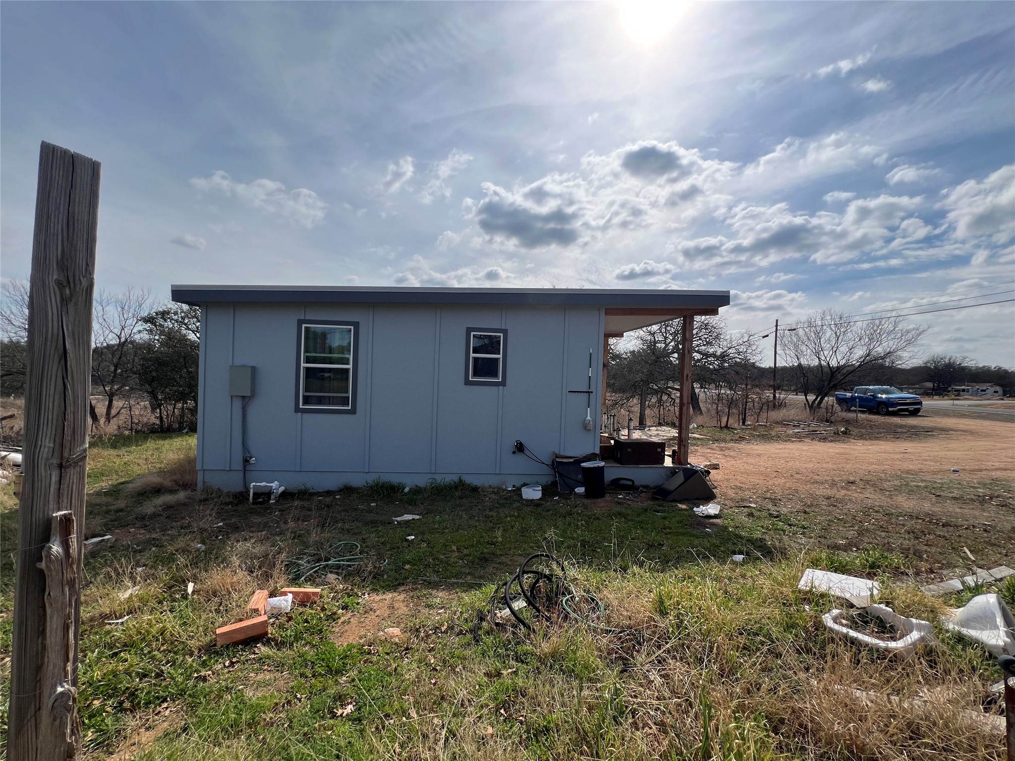 0 Ranch Road 2545 Kingsland, TX 78639 - Photo 6 of 22 a backyard of a house with barbeque oven fire pit table and chairs