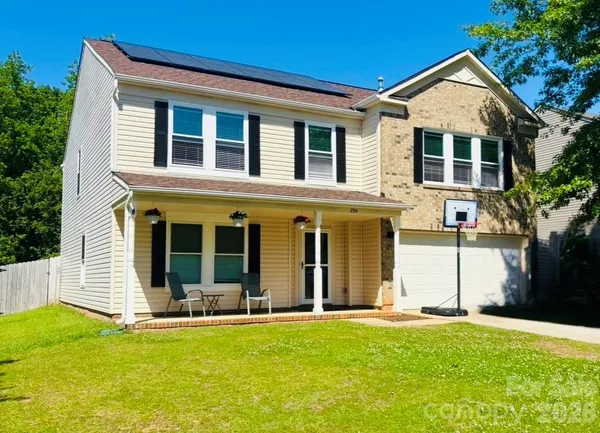 front view of a house with a yard