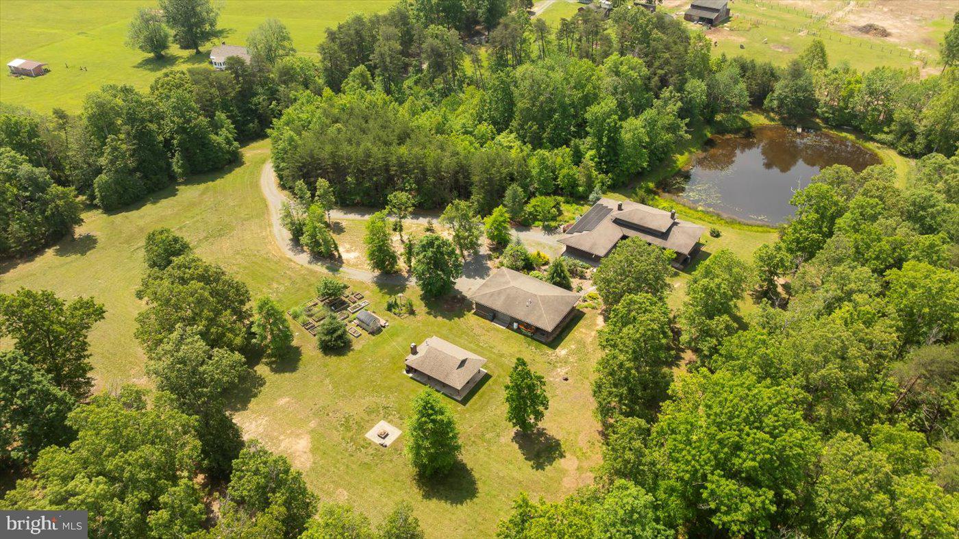 29227 General Rhodes Lane Rhoadesville, VA 22542 - Photo 126 of 129 an aerial view of residential houses with outdoor space and trees all around