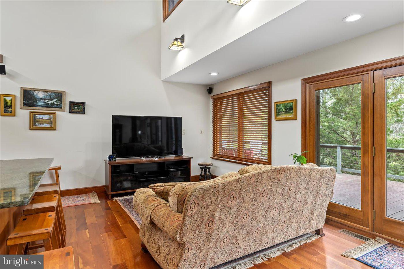 29227 General Rhodes Lane Rhoadesville, VA 22542 - Photo 16 of 129 a living room with furniture and a flat screen tv