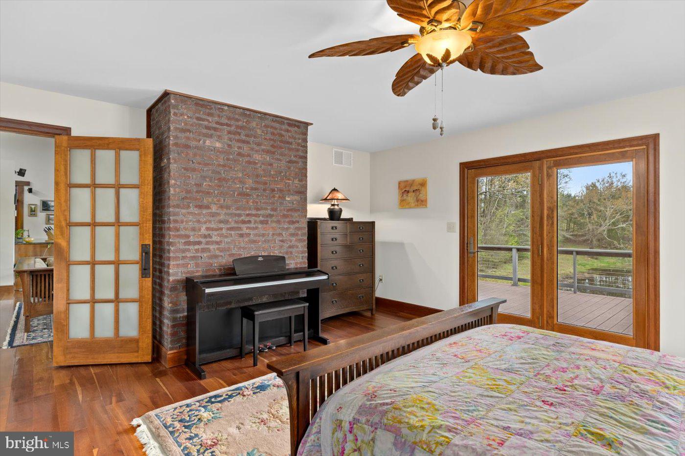 29227 General Rhodes Lane Rhoadesville, VA 22542 - Photo 24 of 129 a bedroom with a bed and wooden floor