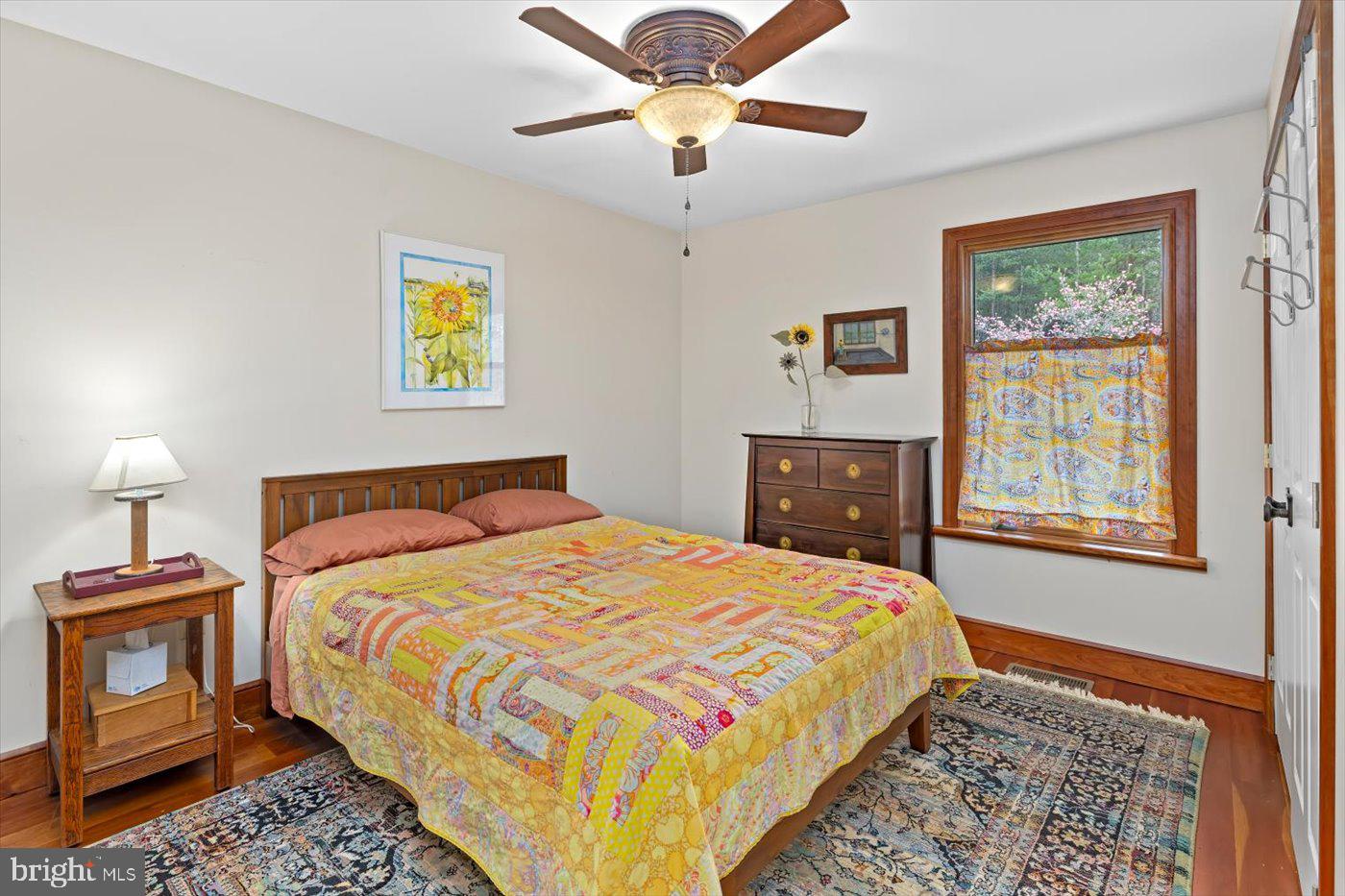 29227 General Rhodes Lane Rhoadesville, VA 22542 - Photo 31 of 129 a bedroom with a bed and a lamp on a dresser