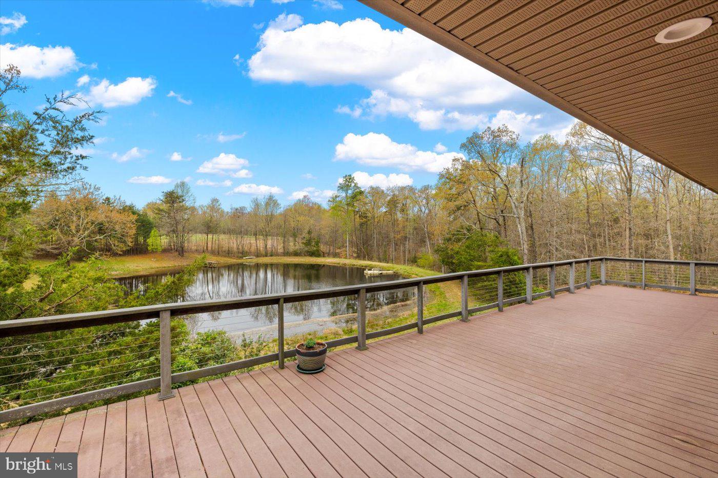 29227 General Rhodes Lane Rhoadesville, VA 22542 - Photo 42 of 129 Full length composite deck offers a stunning pond