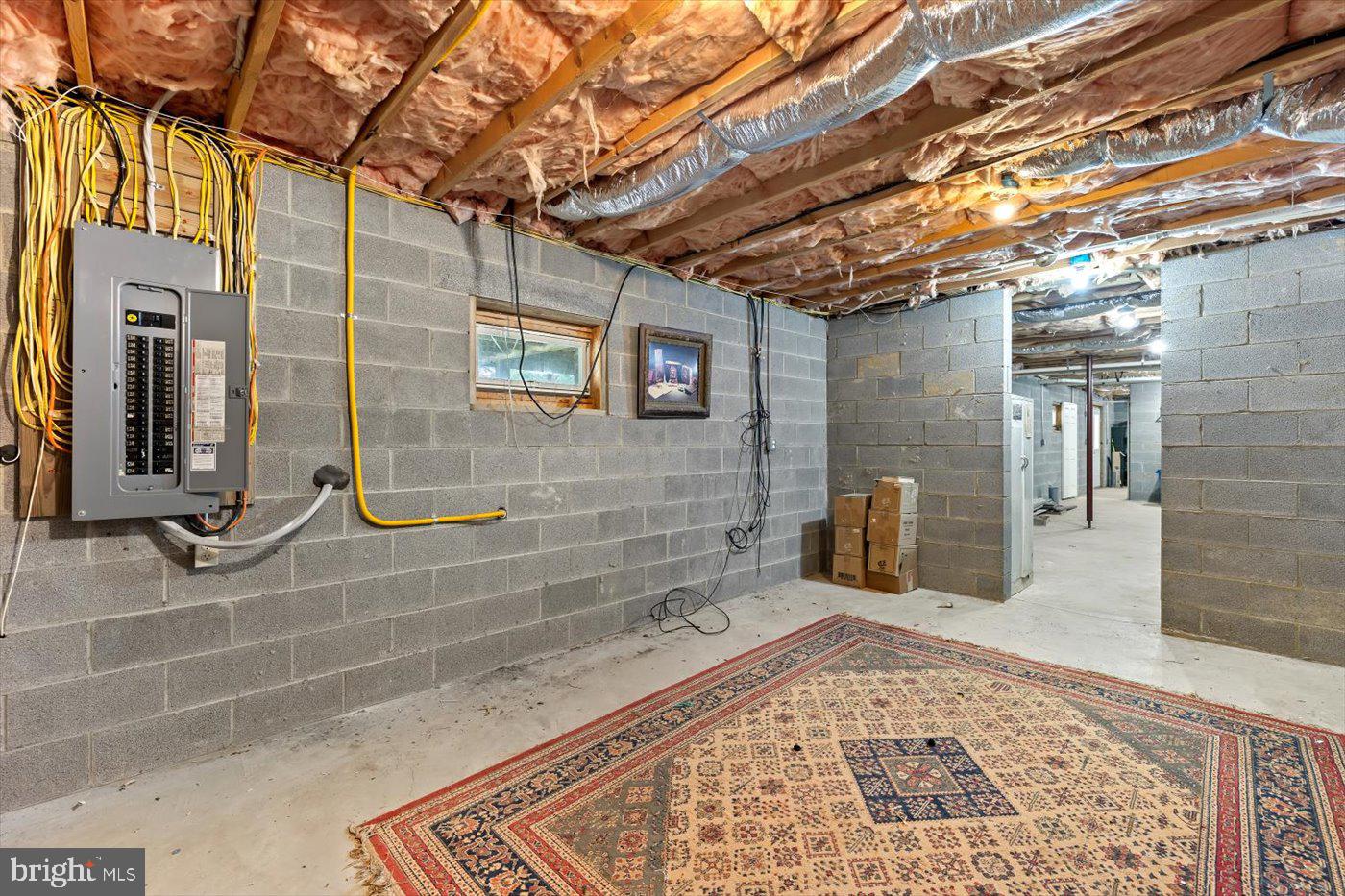 29227 General Rhodes Lane Rhoadesville, VA 22542 - Photo 45 of 129 a view of a brick wall with a bench in front of building