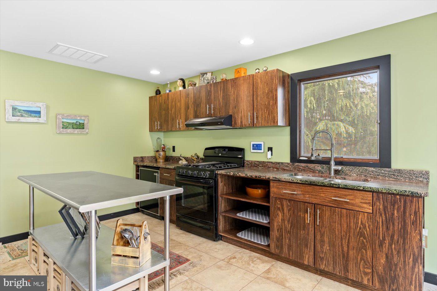 29227 General Rhodes Lane Rhoadesville, VA 22542 - Photo 48 of 129 a kitchen with stainless steel appliances granite countertop a stove a sink and a microwave