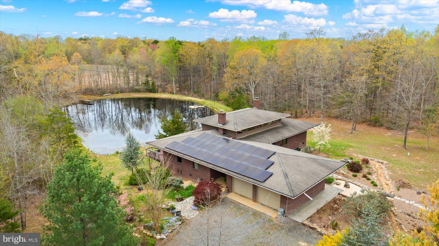 29227 General Rhodes Lane Rhoadesville, VA 22542 - Photo 59 of 129 a view of a backyard with plants and lake view