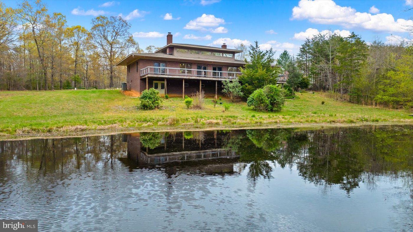 29227 General Rhodes Lane Rhoadesville, VA 22542 - Photo 68 of 129 a view of house with outdoor space and a lake view