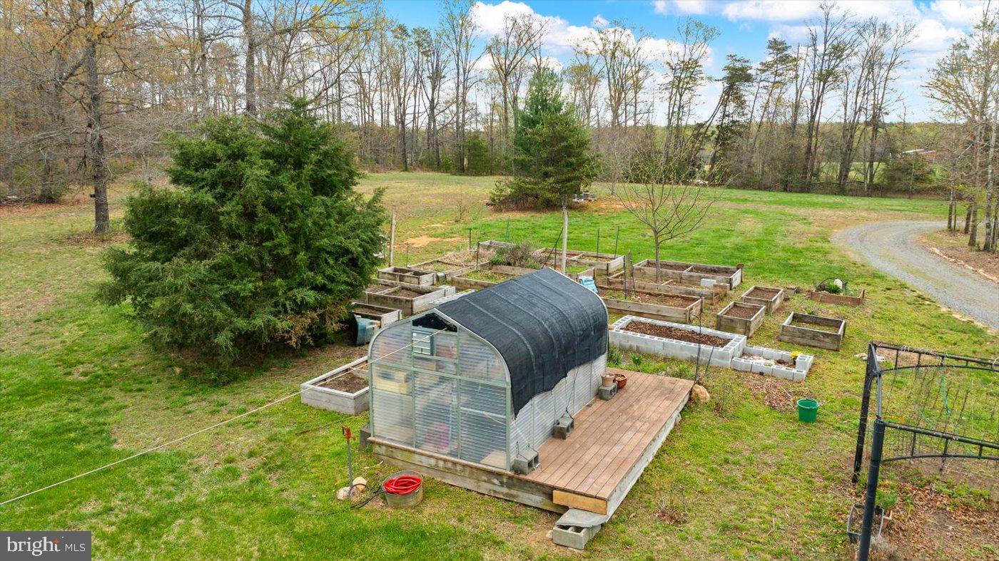 29227 General Rhodes Lane Rhoadesville, VA 22542 - Photo 72 of 129 a view of backyard with swimming pool and outdoor seating