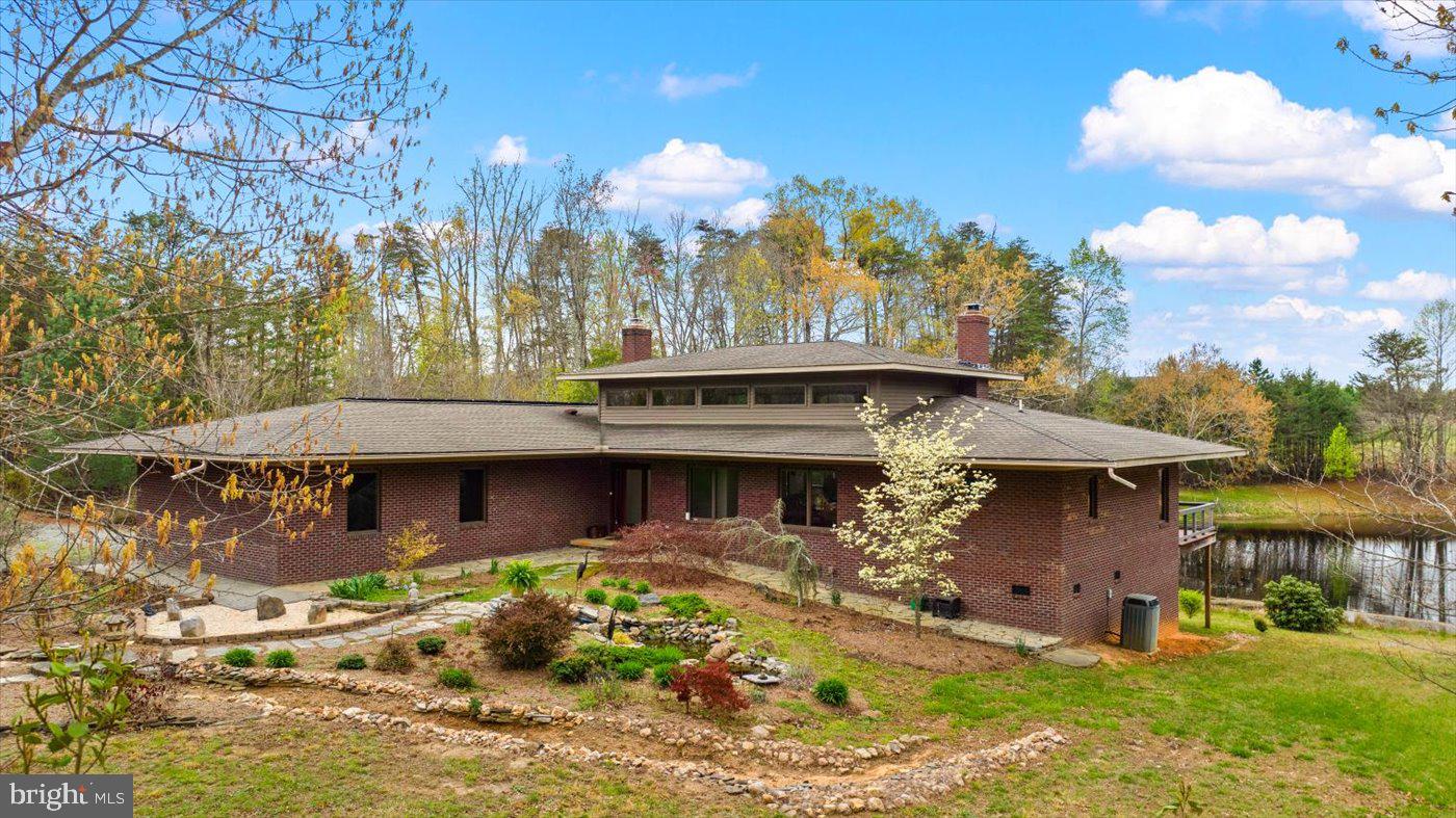 29227 General Rhodes Lane Rhoadesville, VA 22542 - Photo 74 of 129 a view of a house with a yard and garage