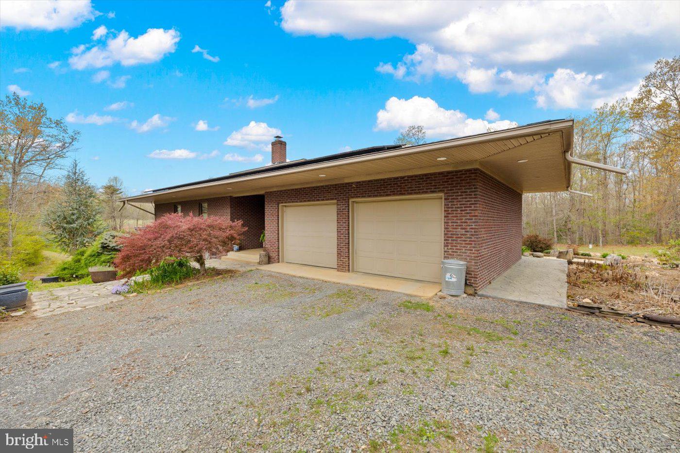 29227 General Rhodes Lane Rhoadesville, VA 22542 - Photo 78 of 129 a front view of a house with a yard and garage