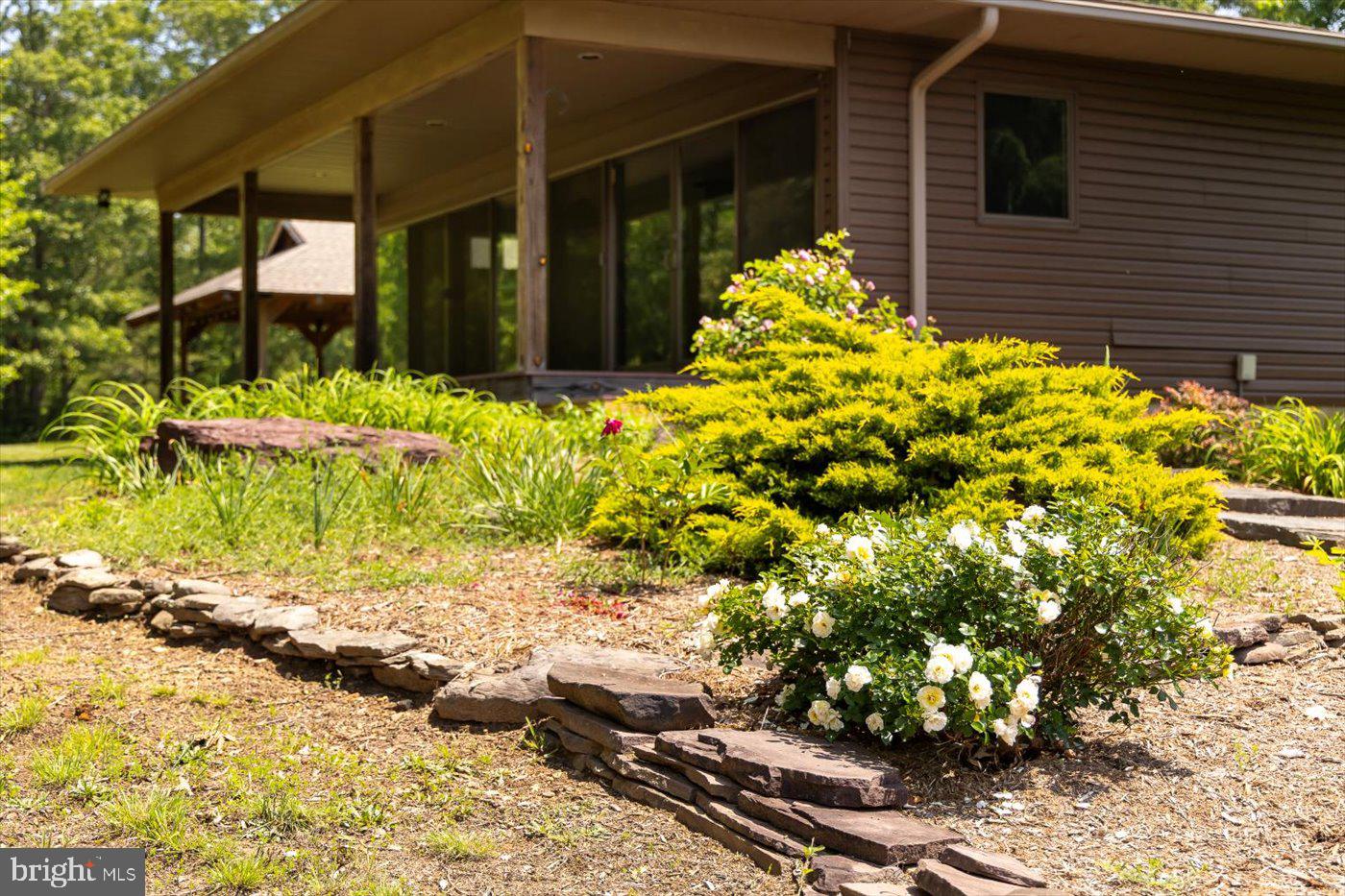 29227 General Rhodes Lane Rhoadesville, VA 22542 - Photo 93 of 129 a view of a pathway of the house front of house