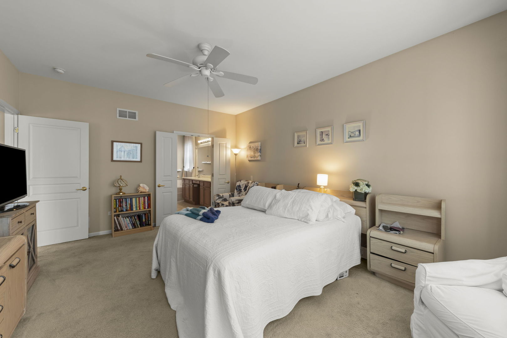 14013 Francesca Cove Huntley, IL 60142 - Photo 16 of 60 a bedroom with a bed and a flat tv screen on dresser