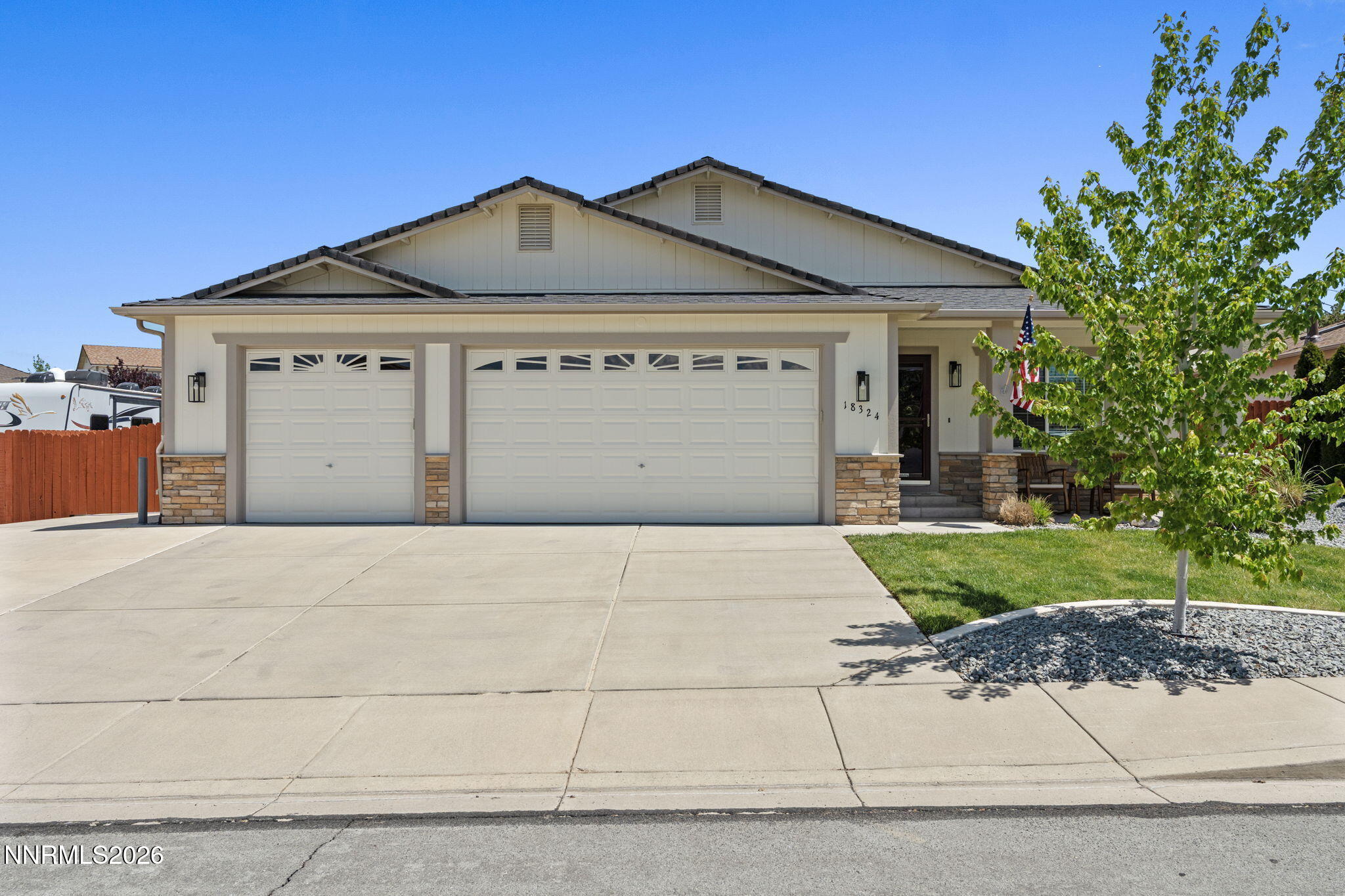 18324 Panda Bear Court Reno, NV 89508 - Photo 37 of 44 a front view of a house with a yard and garage