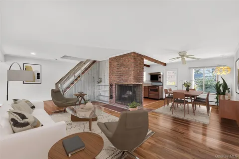 a living room with furniture or kitchen and a fireplace