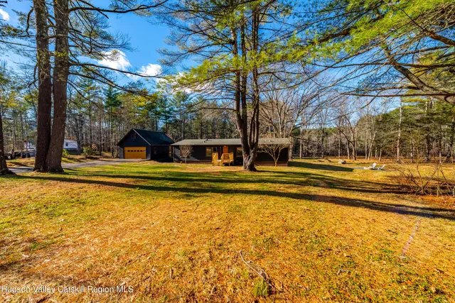 a view of swimming pool with outdoor seating and deck