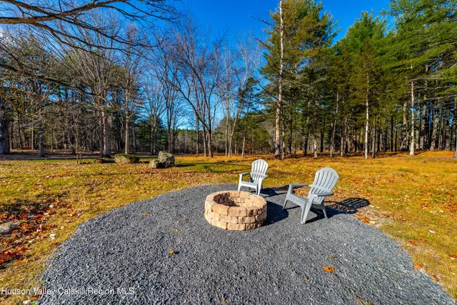 a view of backyard with swimming pool