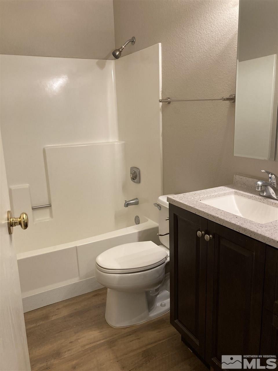 1402 East 9th Street, Unit 6 Reno, NV 89512 - Photo 9 of 10 a bathroom with a sink a toilet and shower