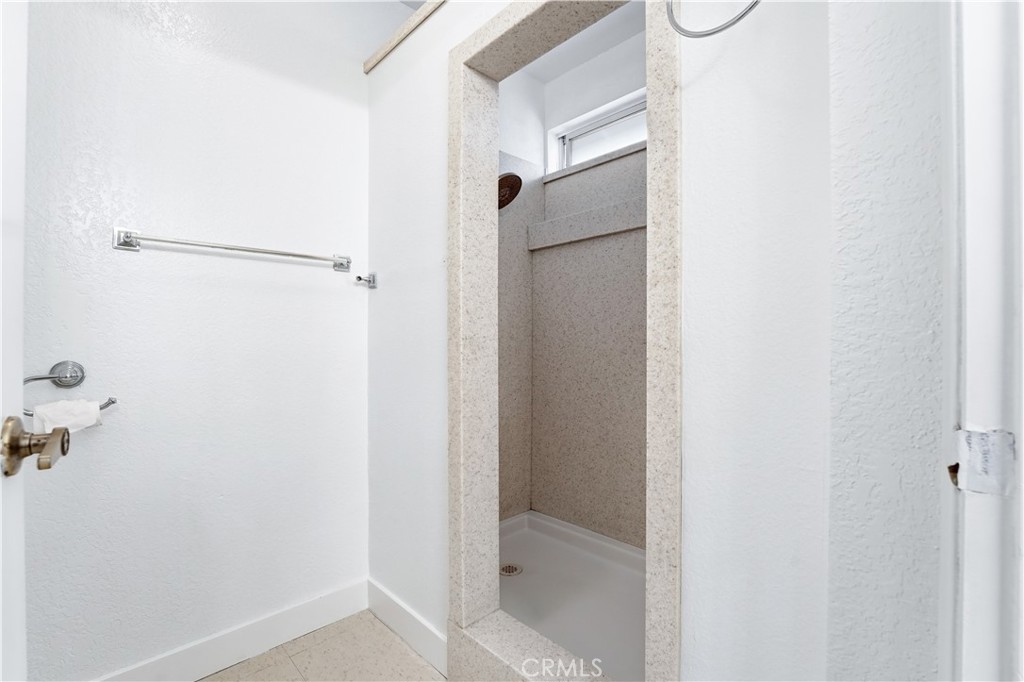 338 Mildred Street Perris, CA 92571 - Photo 18 of 34 a bathroom with a shower
