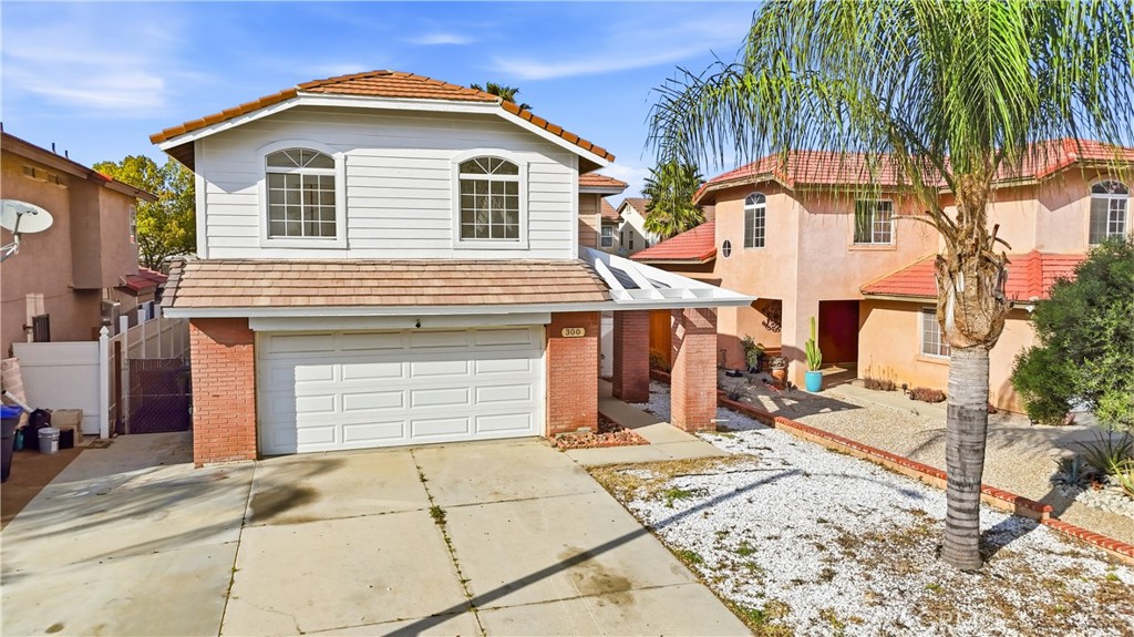 338 Mildred Street Perris, CA 92571 - Photo 24 of 34 a front view of a house with a yard