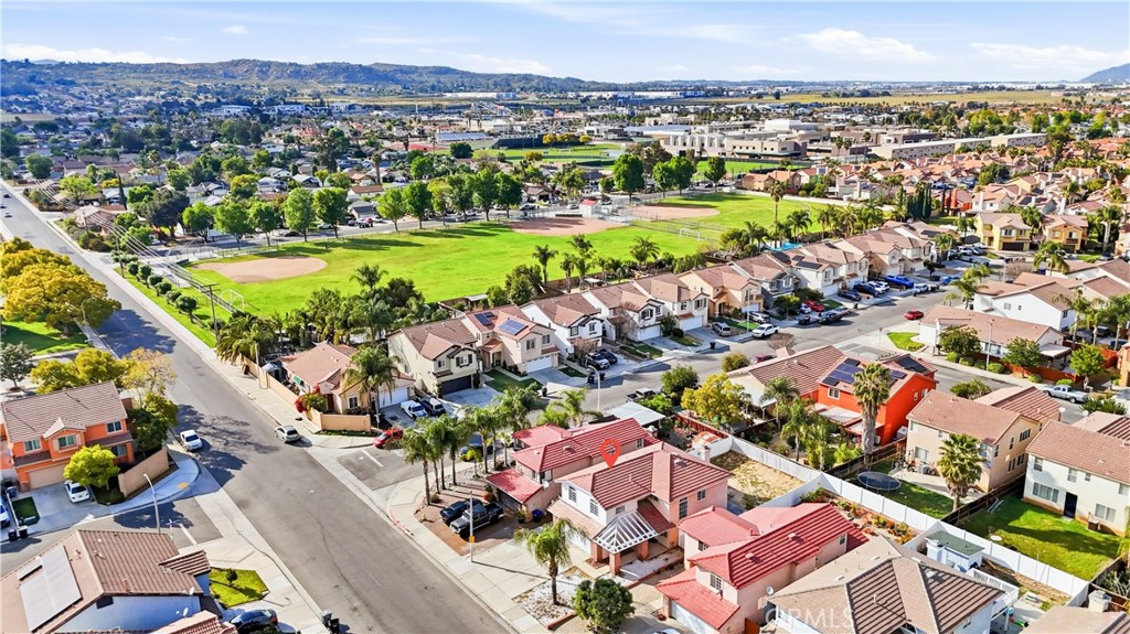 338 Mildred Street Perris, CA 92571 - Photo 29 of 34 an aerial view of a city with lots of residential buildings ocean and mountain view in back