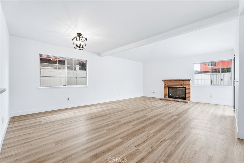 338 Mildred Street Perris, CA 92571 - Photo 7 of 34 an empty room with windows and fireplace