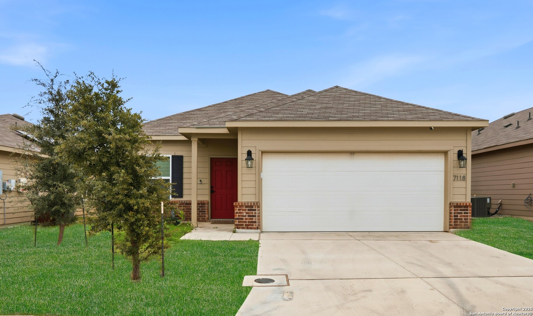 a front view of a house with garden