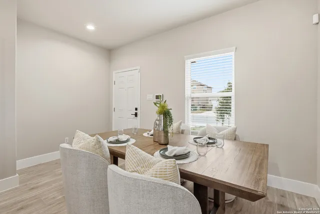 a view of a dining room with furniture window and outside view