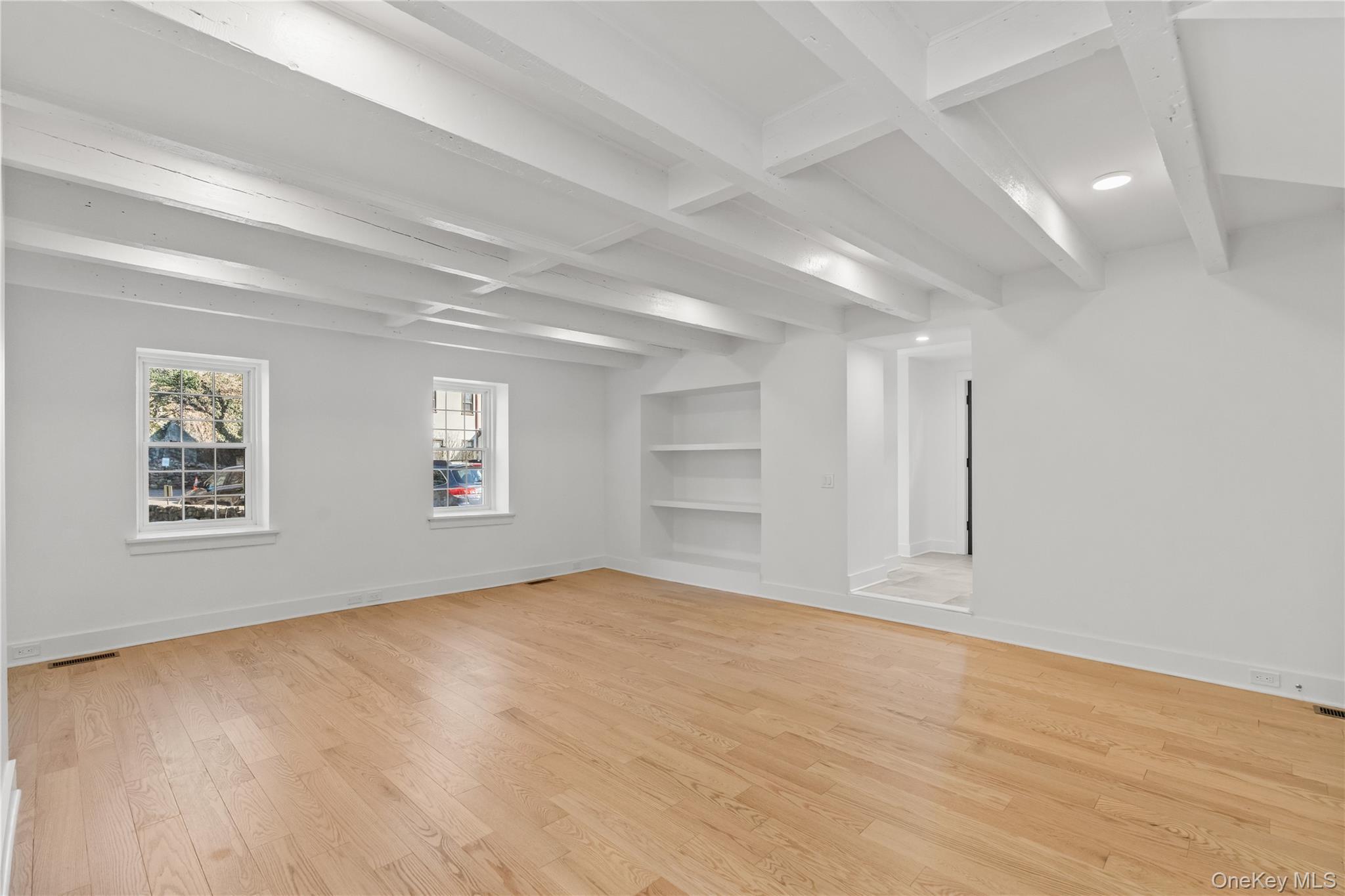 26 Latimer Lane Bronxville, NY 10708 - Photo 13 of 37 an empty room with wooden floor and windows