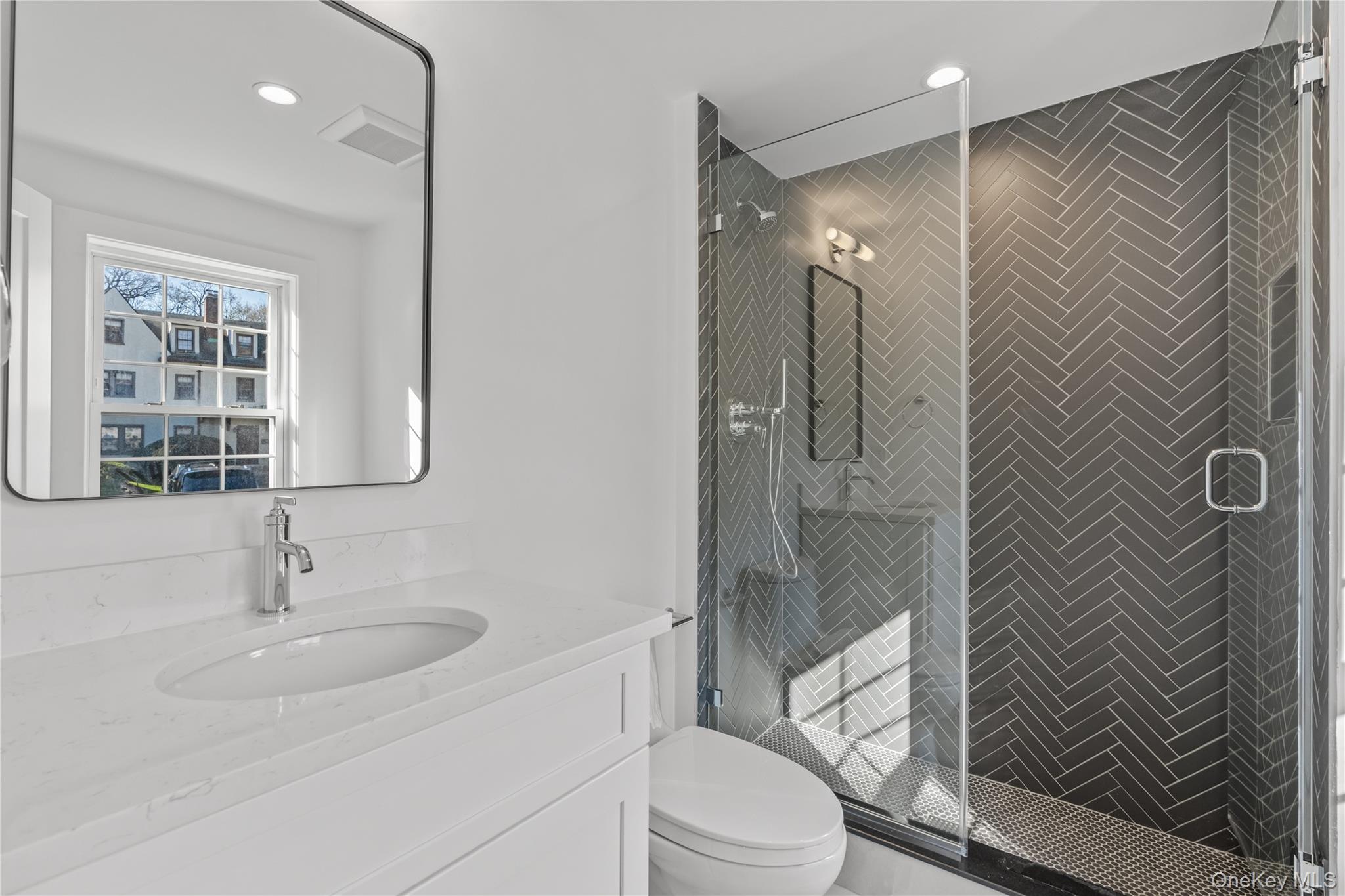 26 Latimer Lane Bronxville, NY 10708 - Photo 15 of 37 a bathroom with a sink toilet and shower