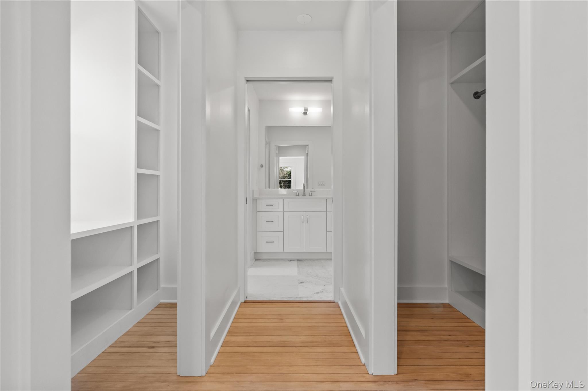 26 Latimer Lane Bronxville, NY 10708 - Photo 19 of 37 a view of a hallway with wooden floor and a cabinet