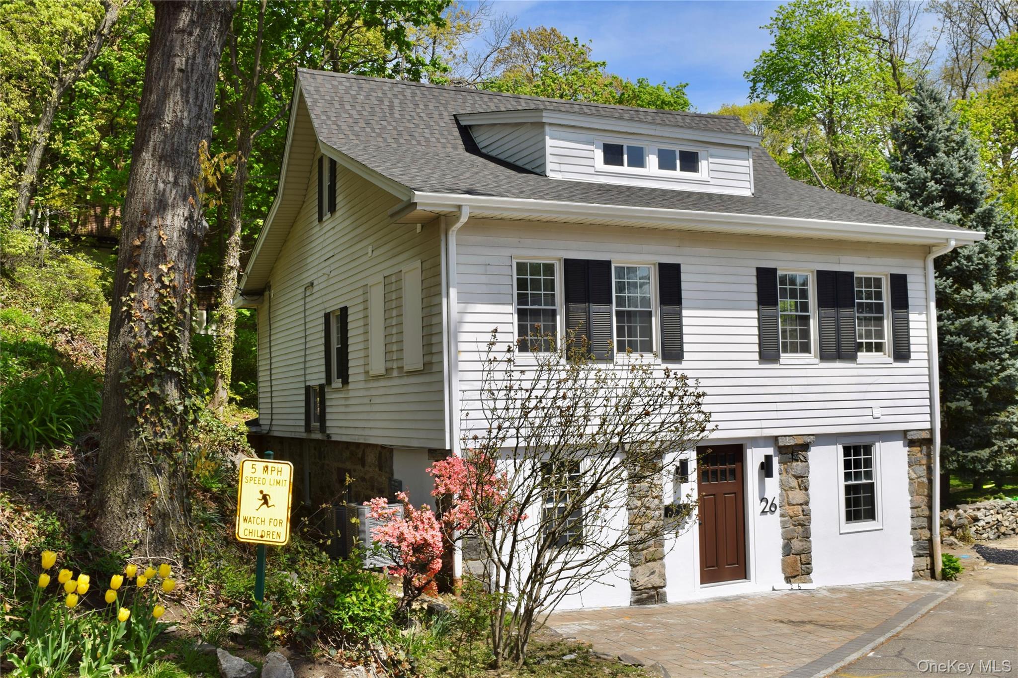 26 Latimer Lane Bronxville, NY 10708 - Photo 2 of 37 a front view of a house with garden