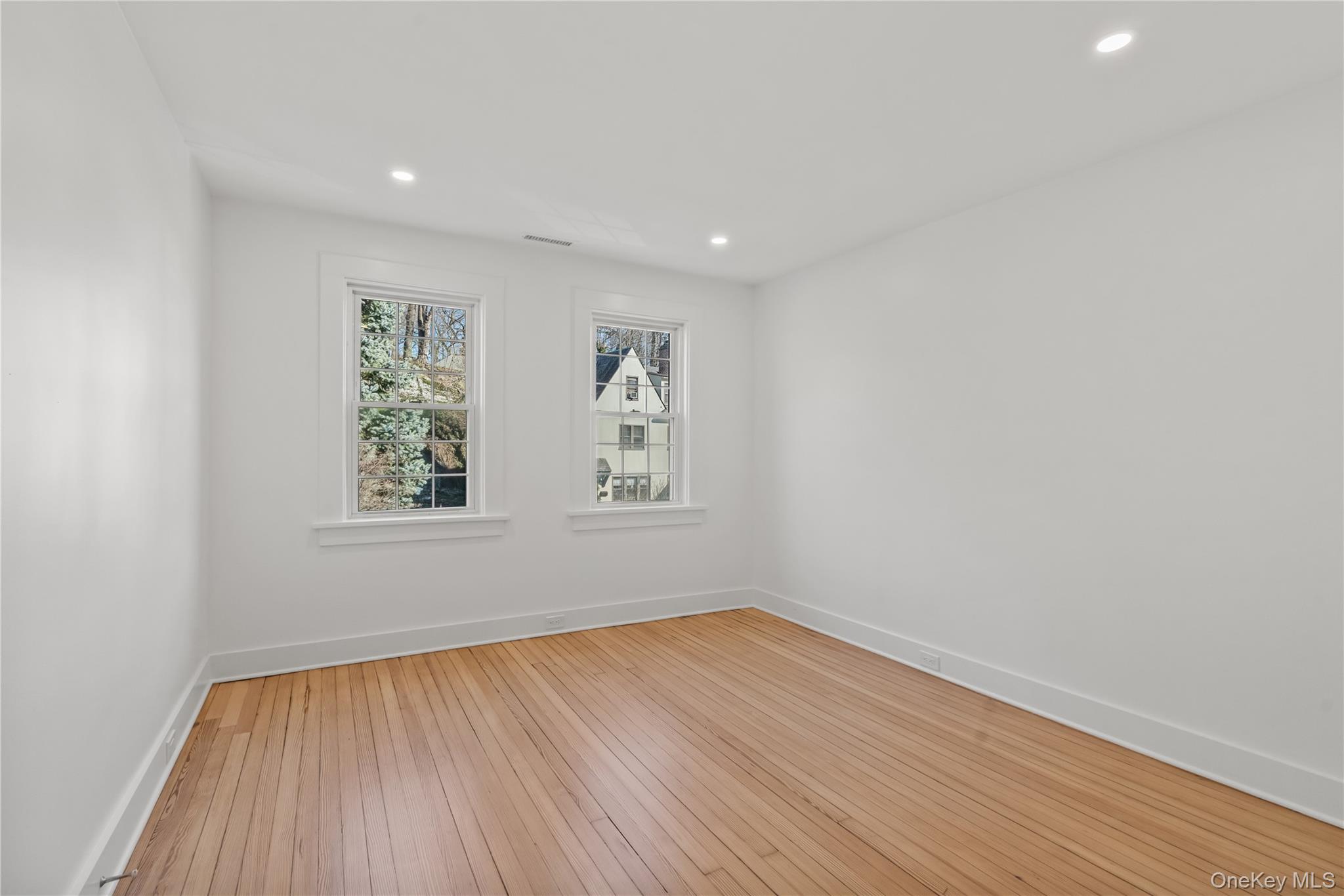 26 Latimer Lane Bronxville, NY 10708 - Photo 23 of 37 a view of room with window and hardwood floor