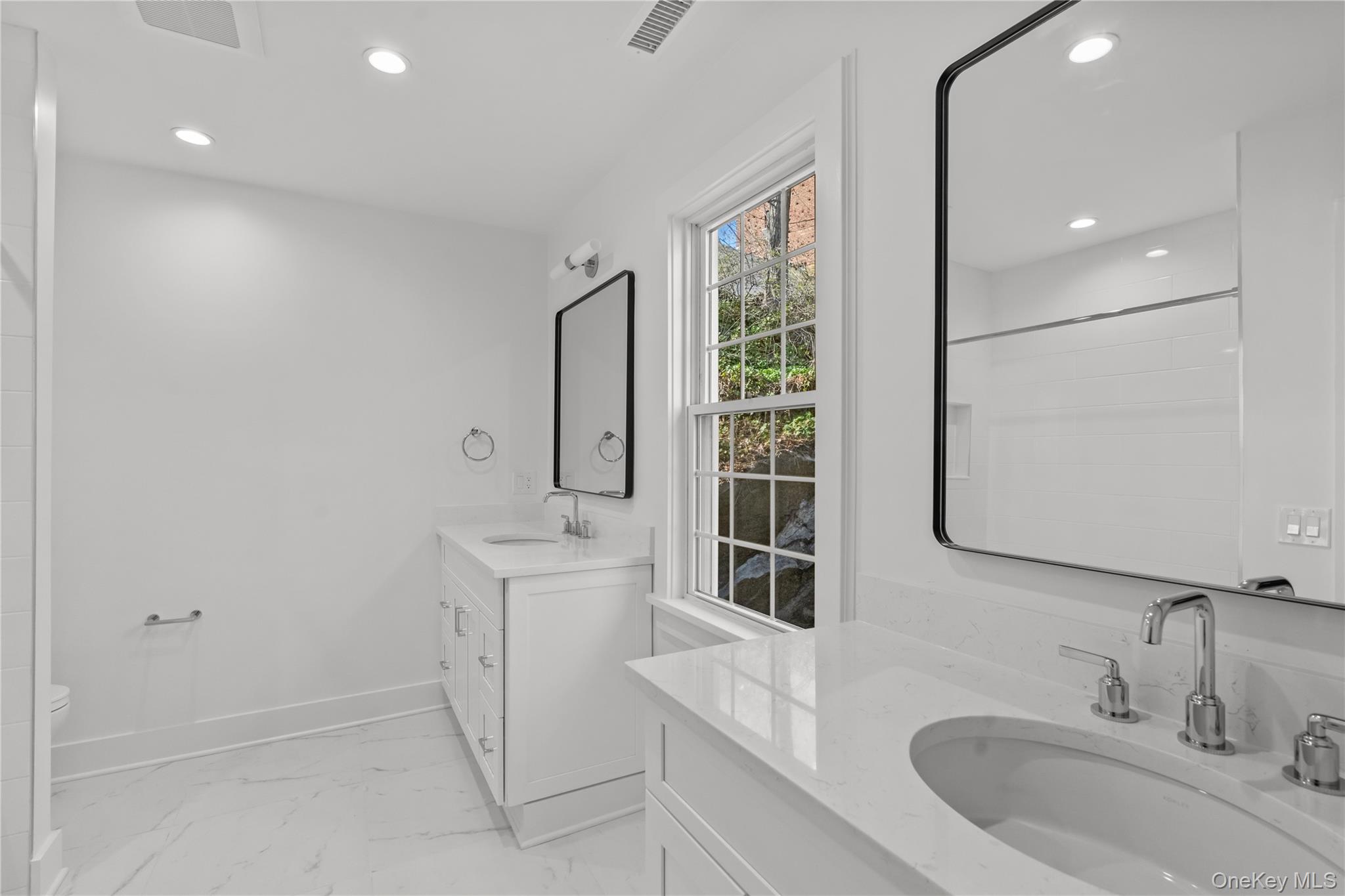 26 Latimer Lane Bronxville, NY 10708 - Photo 25 of 37 a bathroom with a sink a toilet and shower