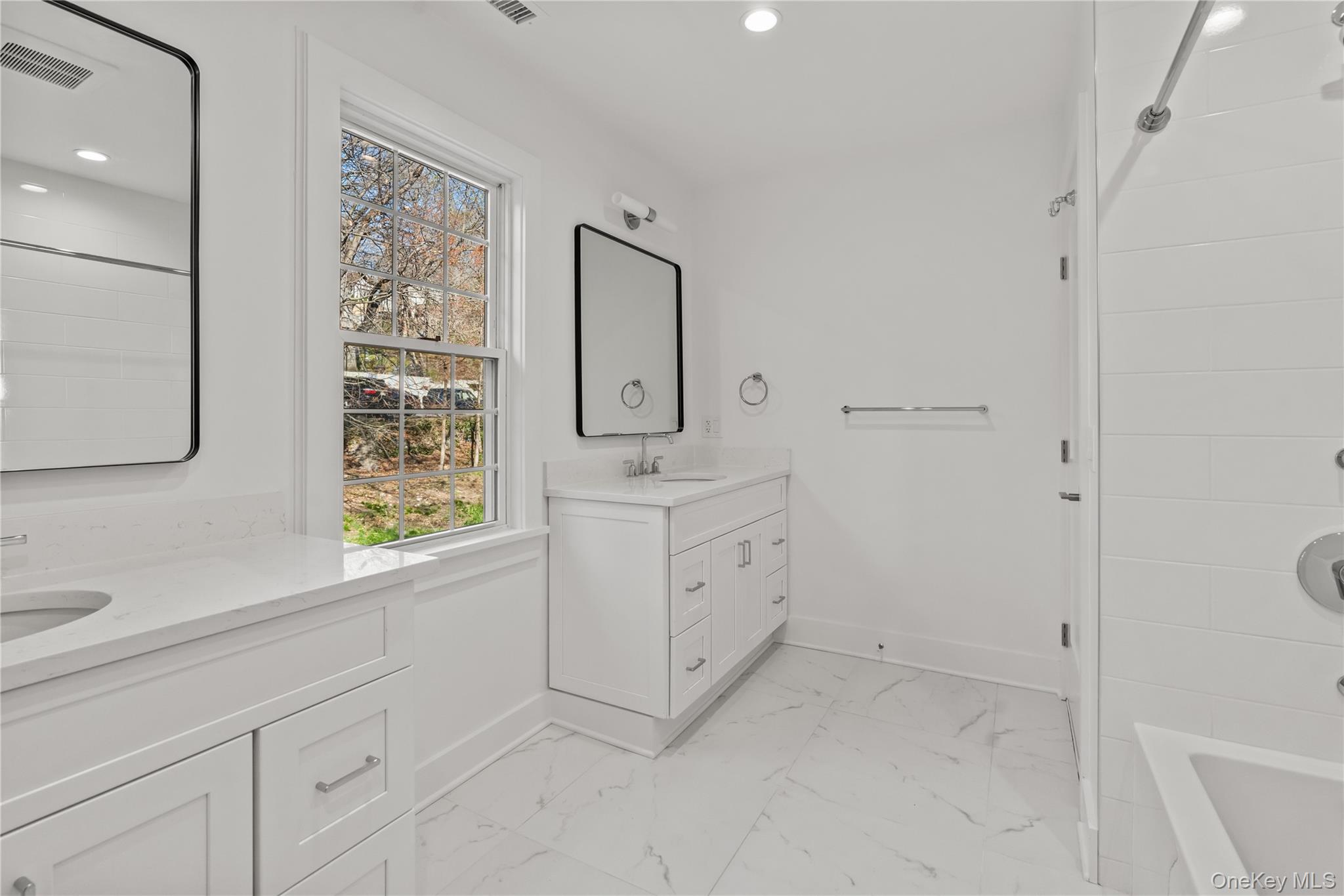 26 Latimer Lane Bronxville, NY 10708 - Photo 27 of 37 a room with white cabinets and window