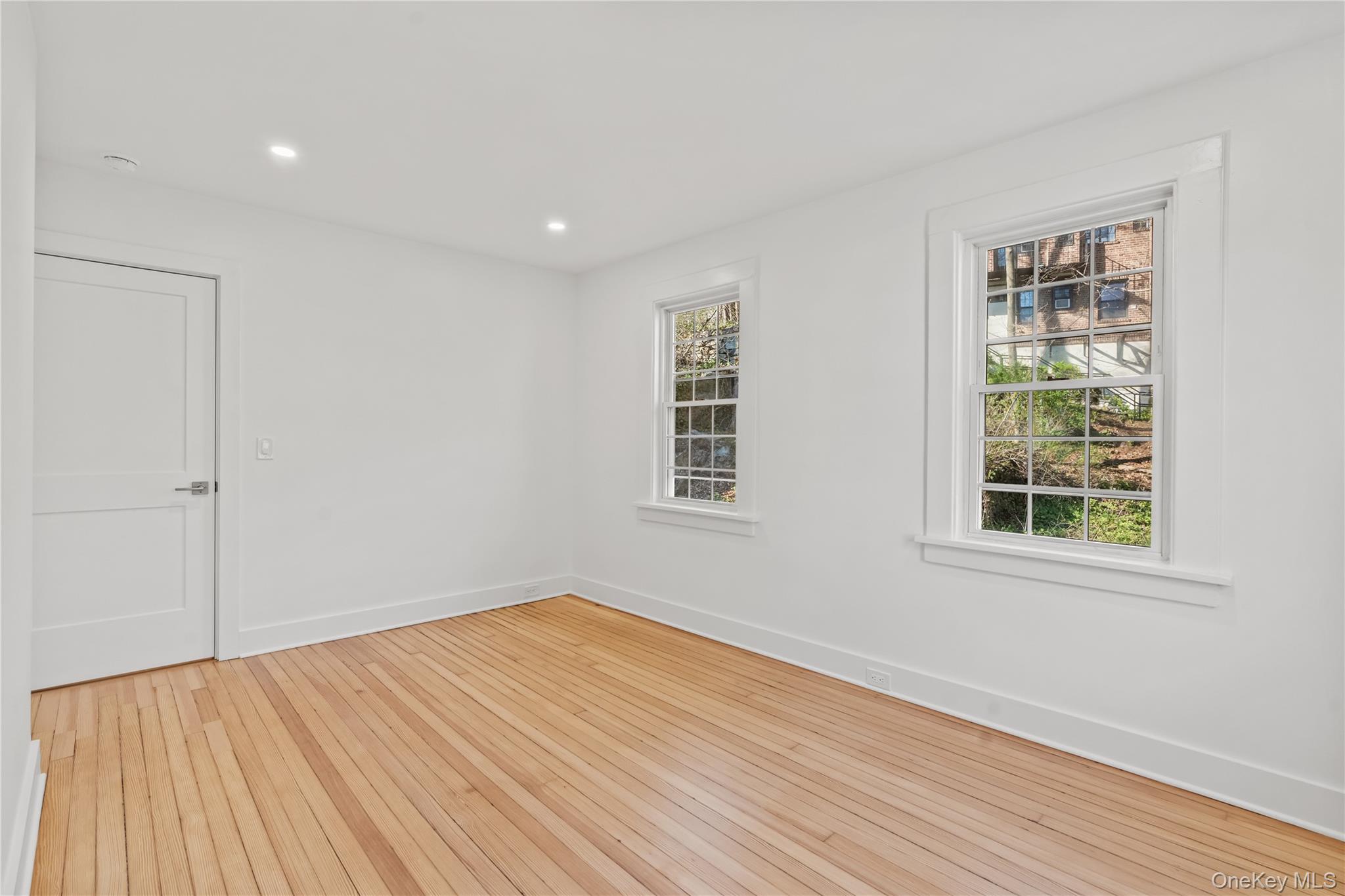 26 Latimer Lane Bronxville, NY 10708 - Photo 29 of 37 a view of empty room with wooden floor and fan