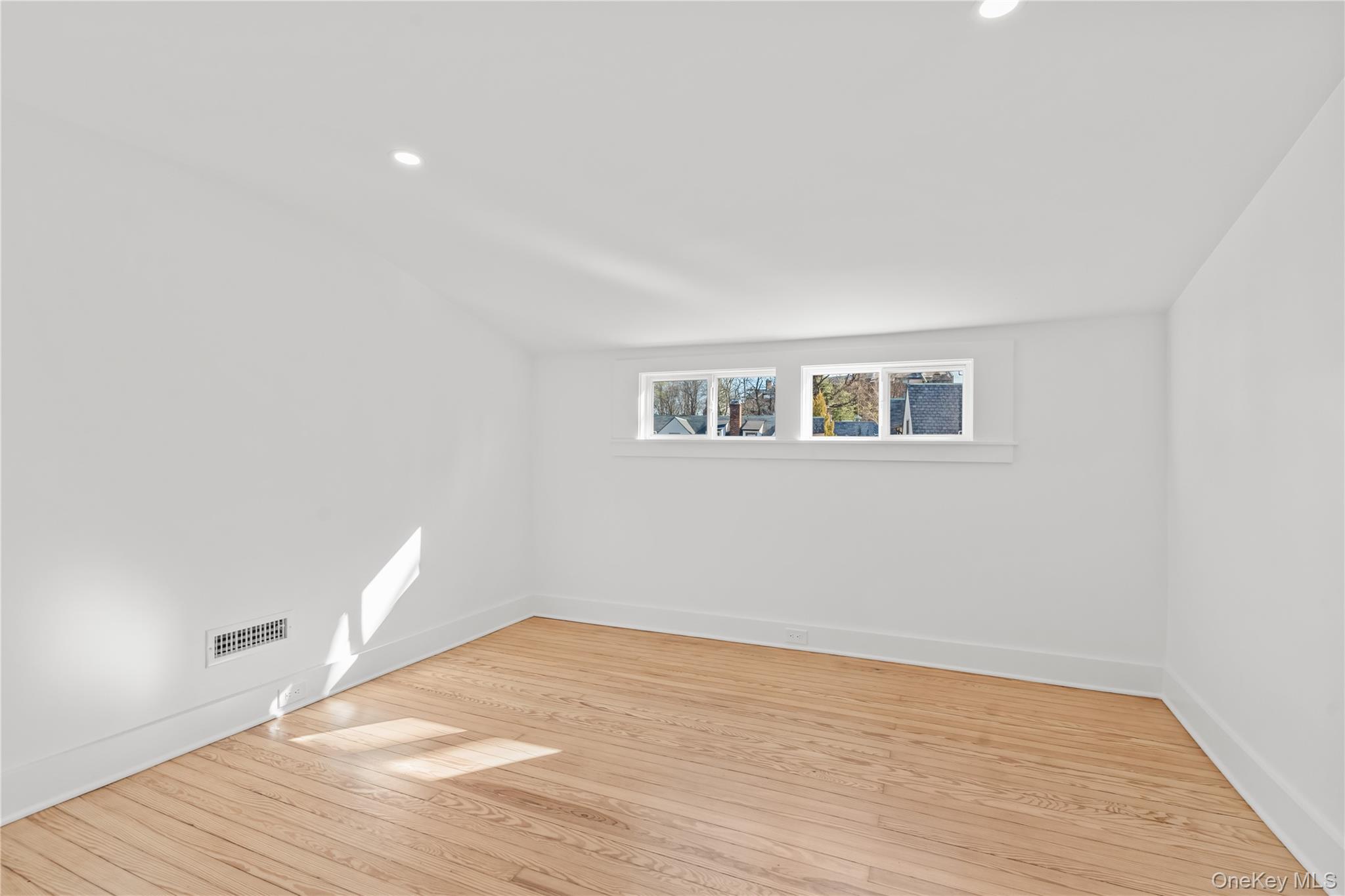26 Latimer Lane Bronxville, NY 10708 - Photo 30 of 37 a view of a room with wooden floor and white walls