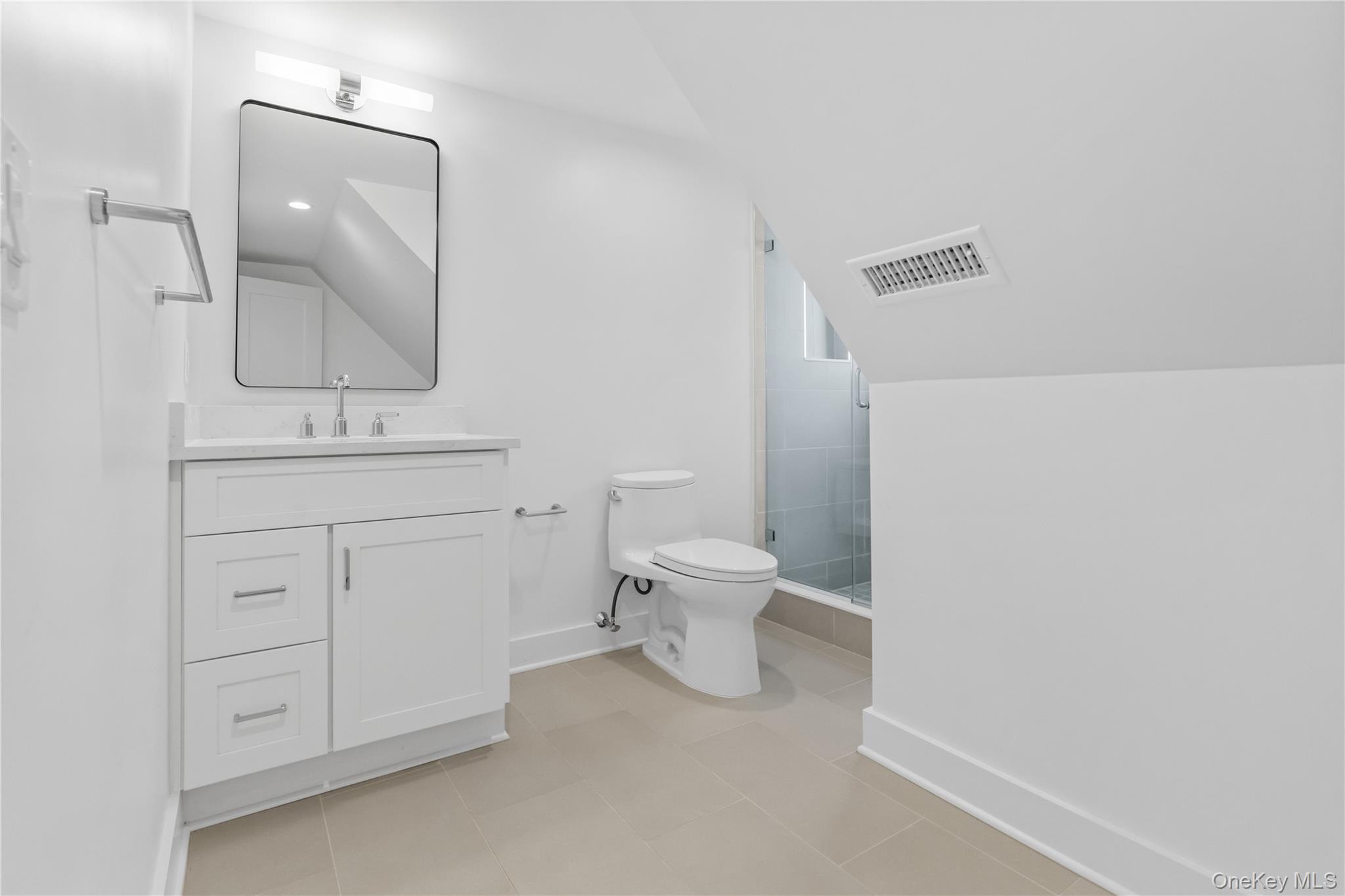 26 Latimer Lane Bronxville, NY 10708 - Photo 31 of 37 a bathroom with a toilet sink and mirror
