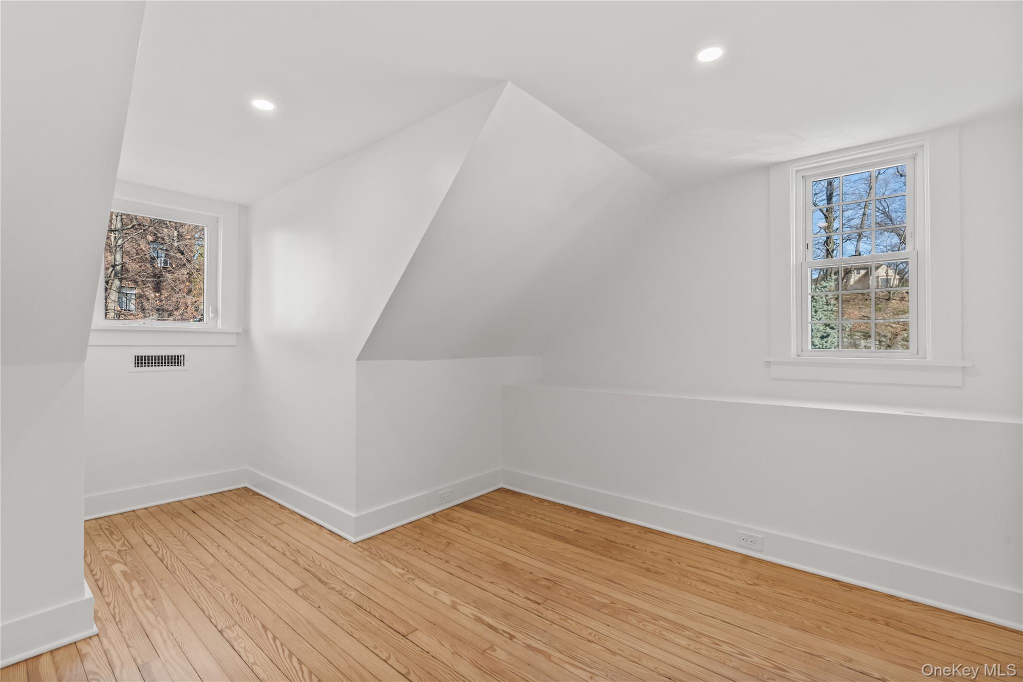 26 Latimer Lane Bronxville, NY 10708 - Photo 32 of 37 a view of empty room with wooden floor and fan