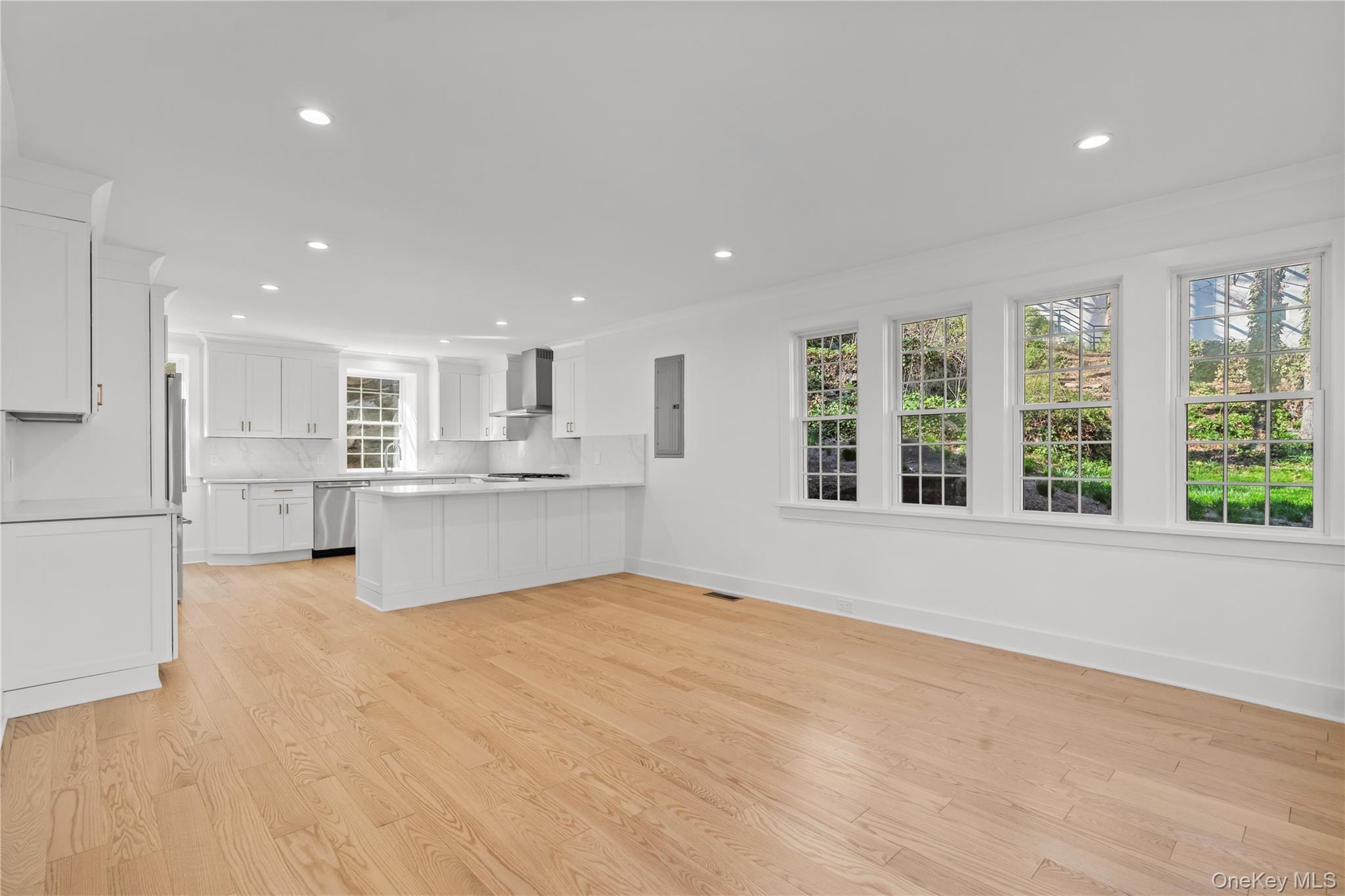 26 Latimer Lane Bronxville, NY 10708 - Photo 7 of 37 Open space kitchen/dining with windows all four sides.