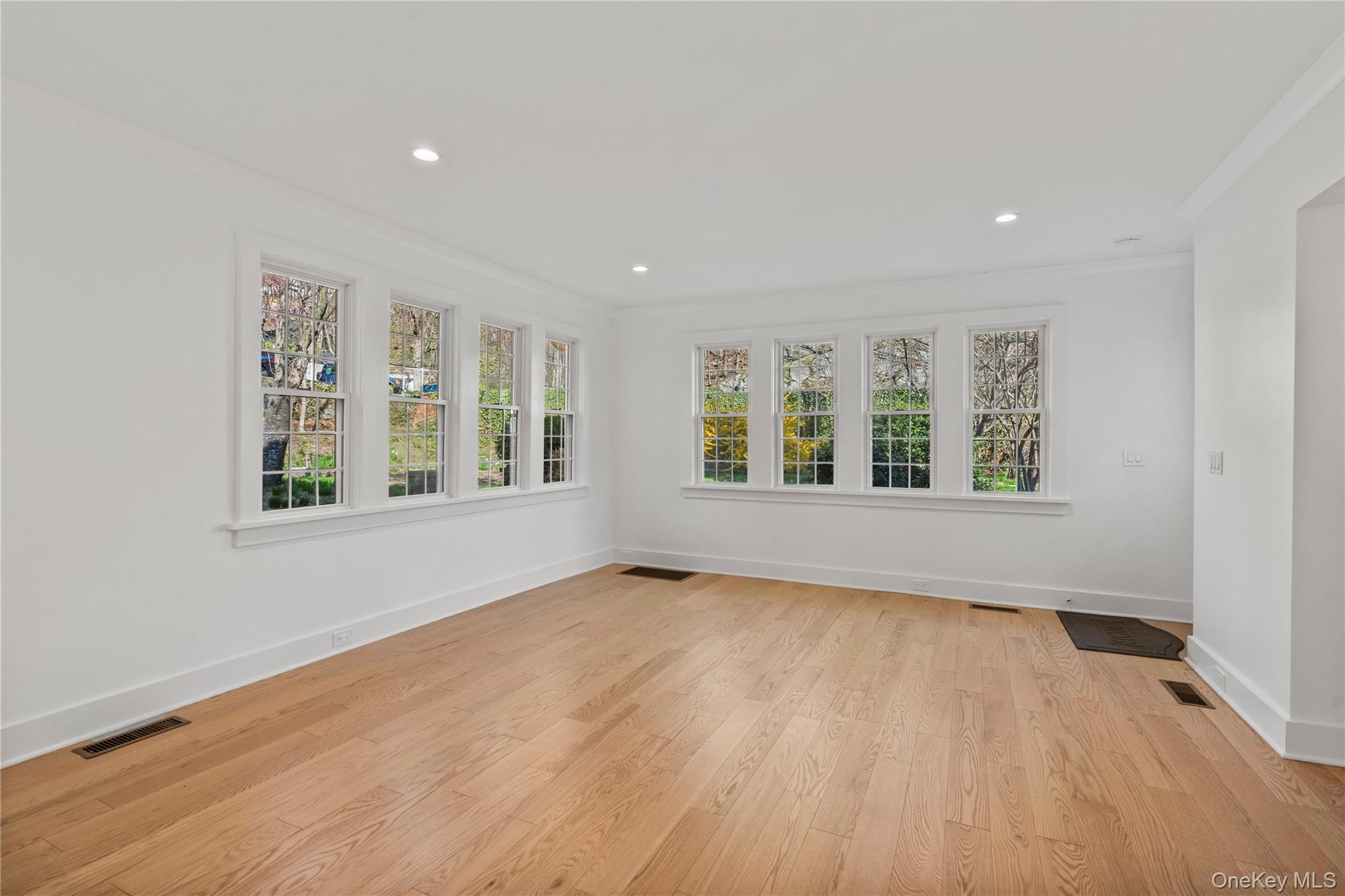 26 Latimer Lane Bronxville, NY 10708 - Photo 8 of 37 wooden floor in an empty room with a window