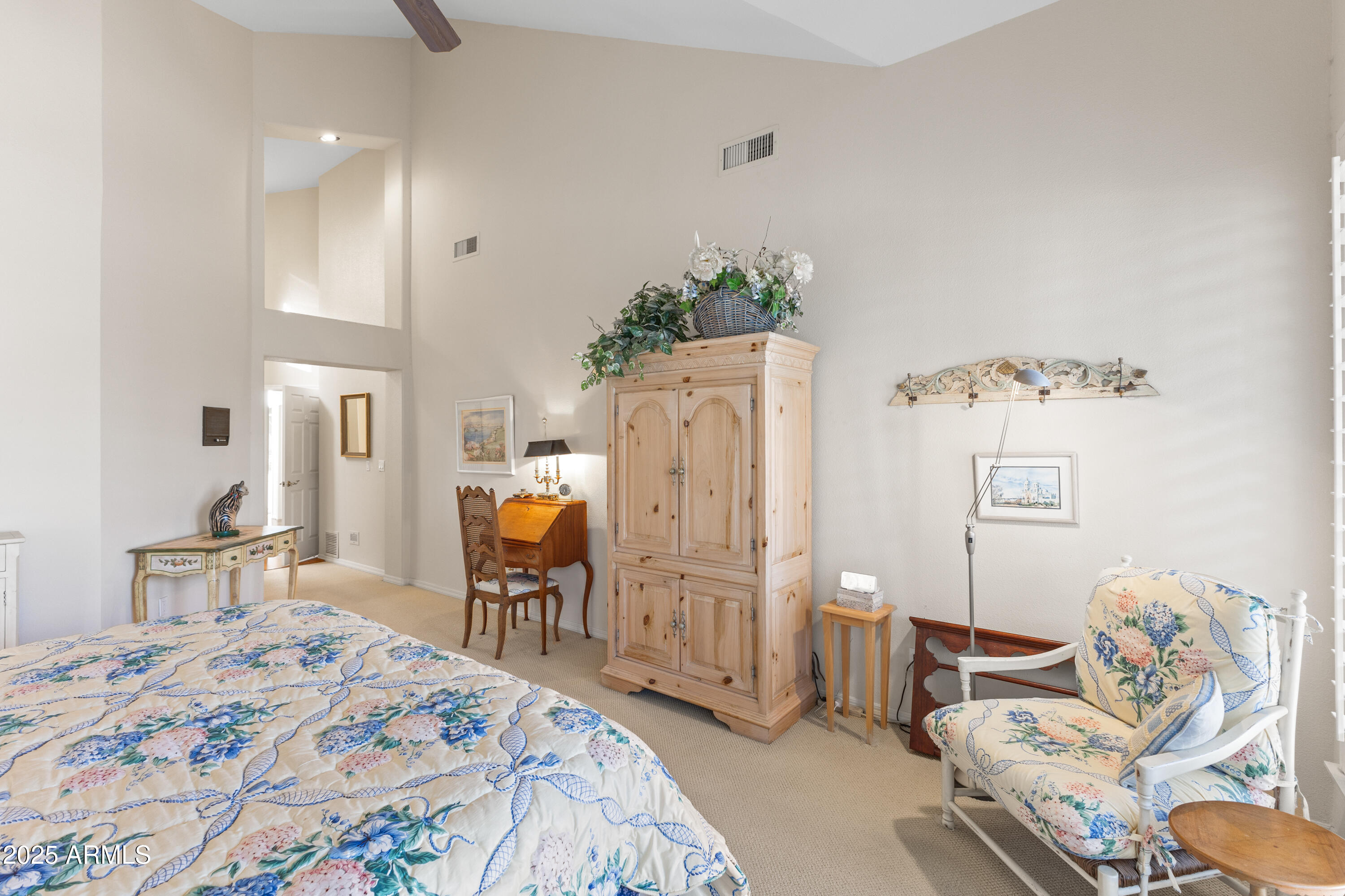 7525 East Gainey Ranch Road, Unit 164 Scottsdale, AZ 85258 - Photo 21 of 51 a bedroom with furniture and a bed