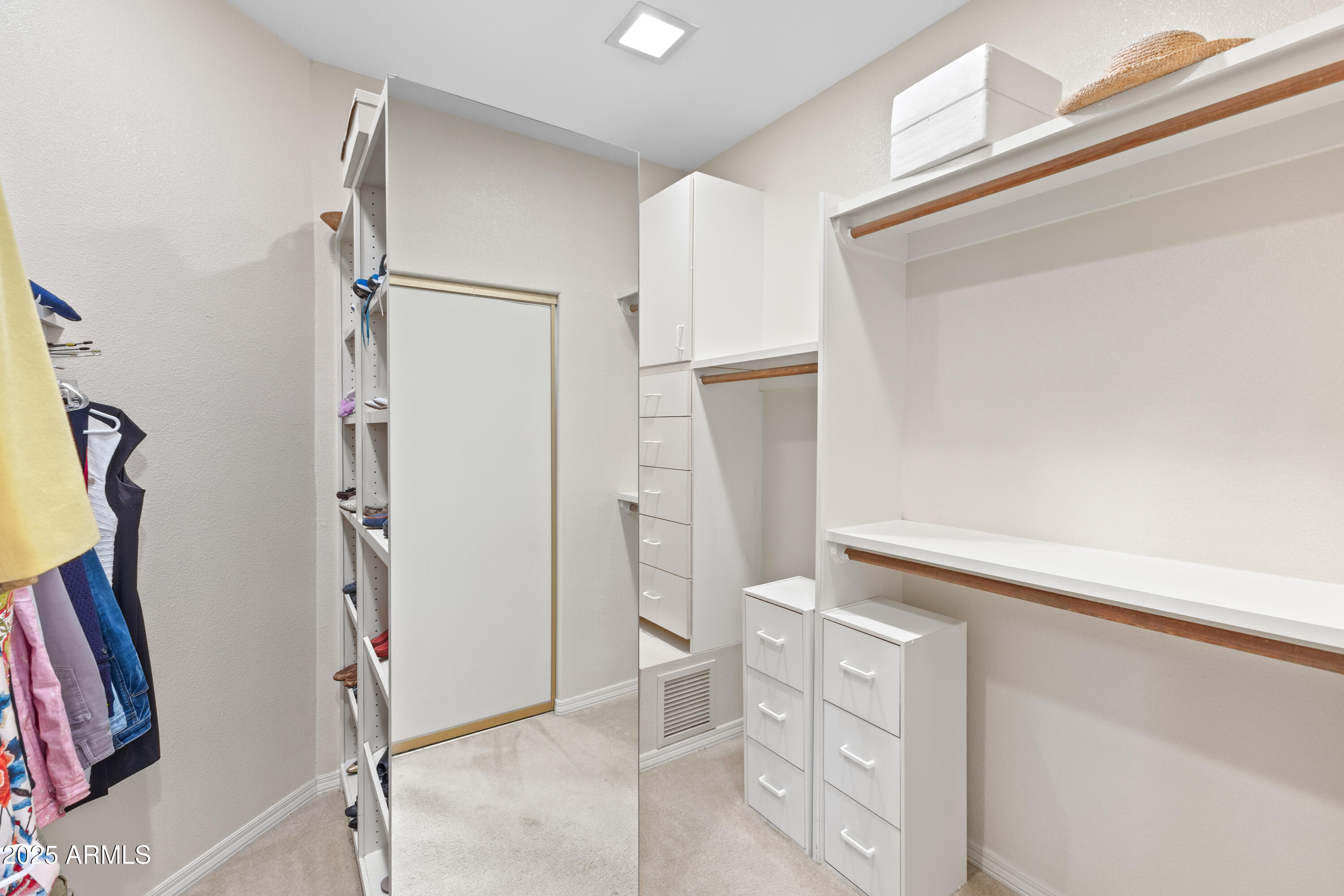 7525 East Gainey Ranch Road, Unit 164 Scottsdale, AZ 85258 - Photo 26 of 51 a view of walk in closet with empty racks