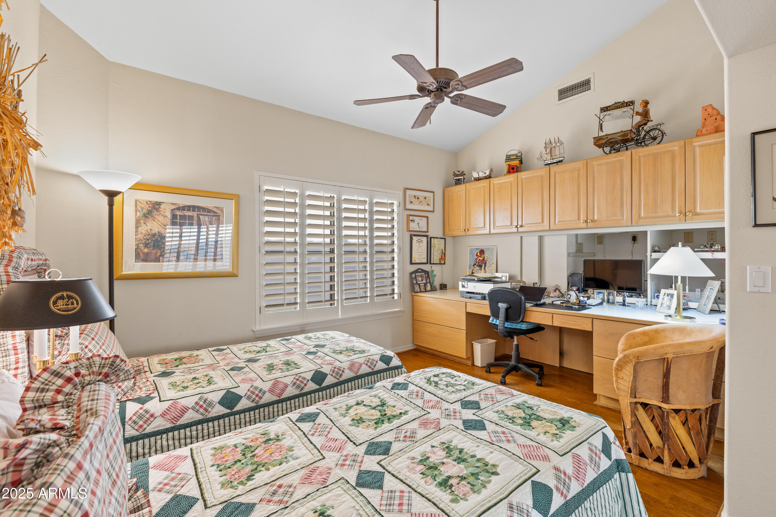 7525 East Gainey Ranch Road, Unit 164 Scottsdale, AZ 85258 - Photo 27 of 51 a bedroom with a bed a table and chair