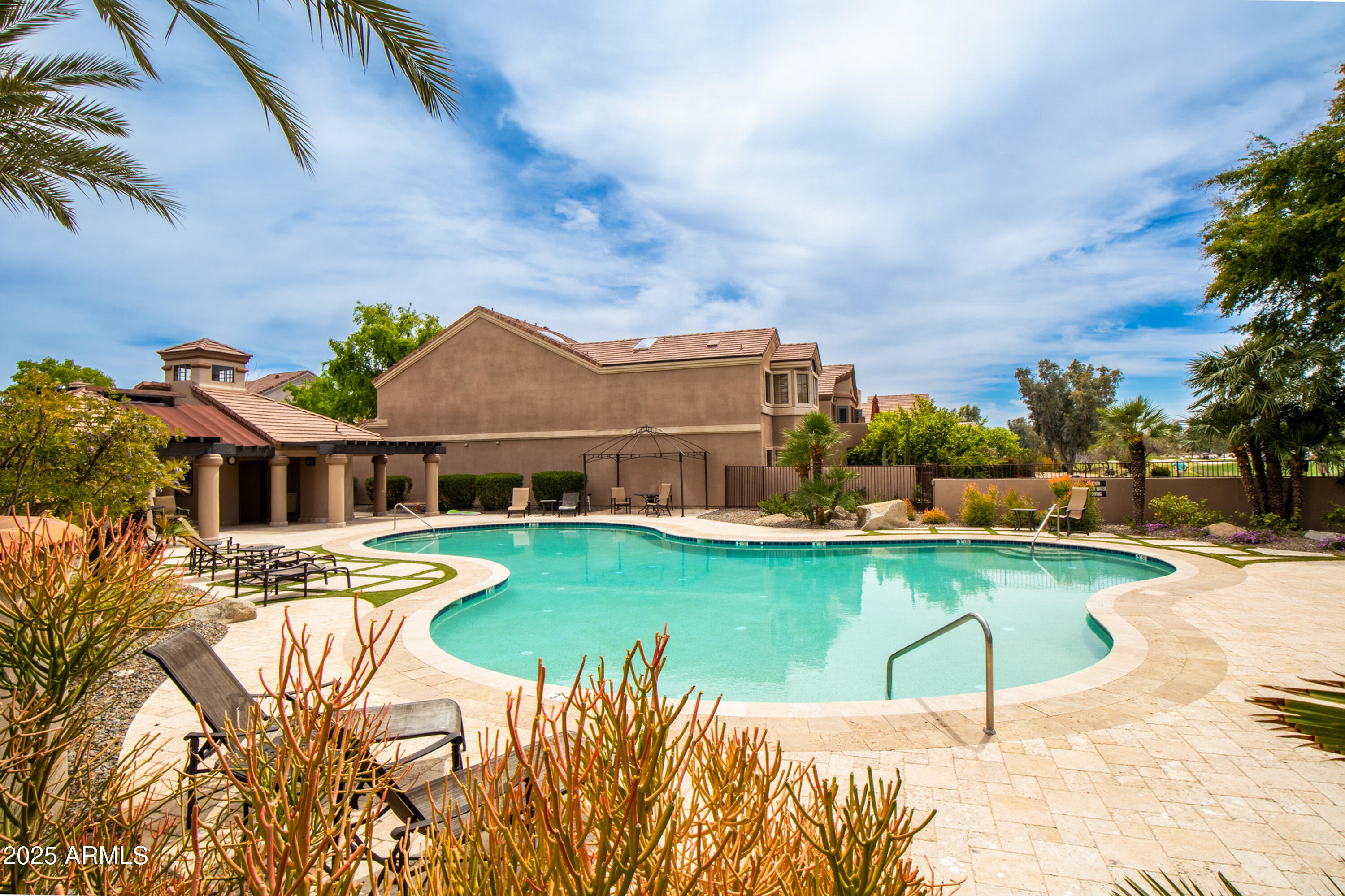 7525 East Gainey Ranch Road, Unit 164 Scottsdale, AZ 85258 - Photo 38 of 51 a view of a house with pool and chairs