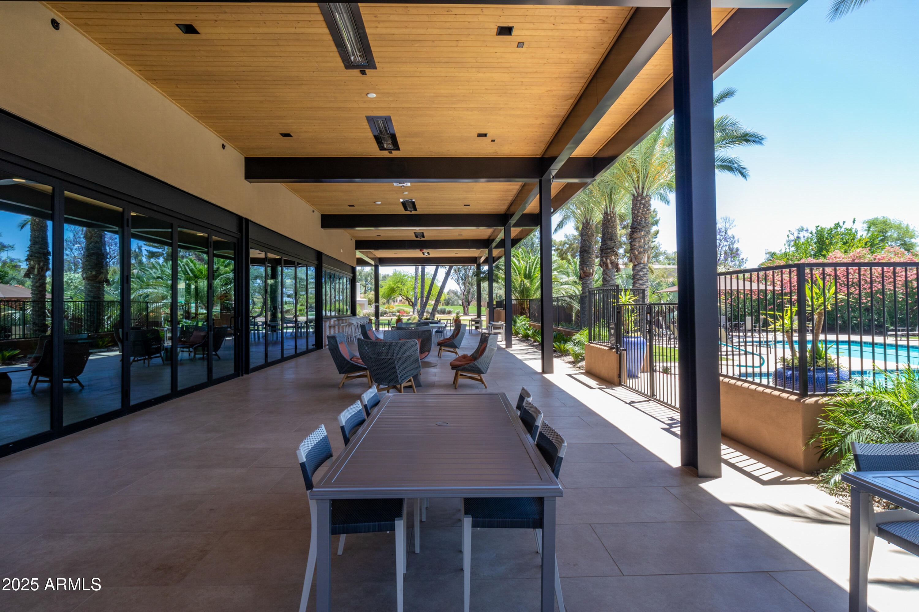 7525 East Gainey Ranch Road, Unit 164 Scottsdale, AZ 85258 - Photo 46 of 51 a lobby with furniture and floor to ceiling window